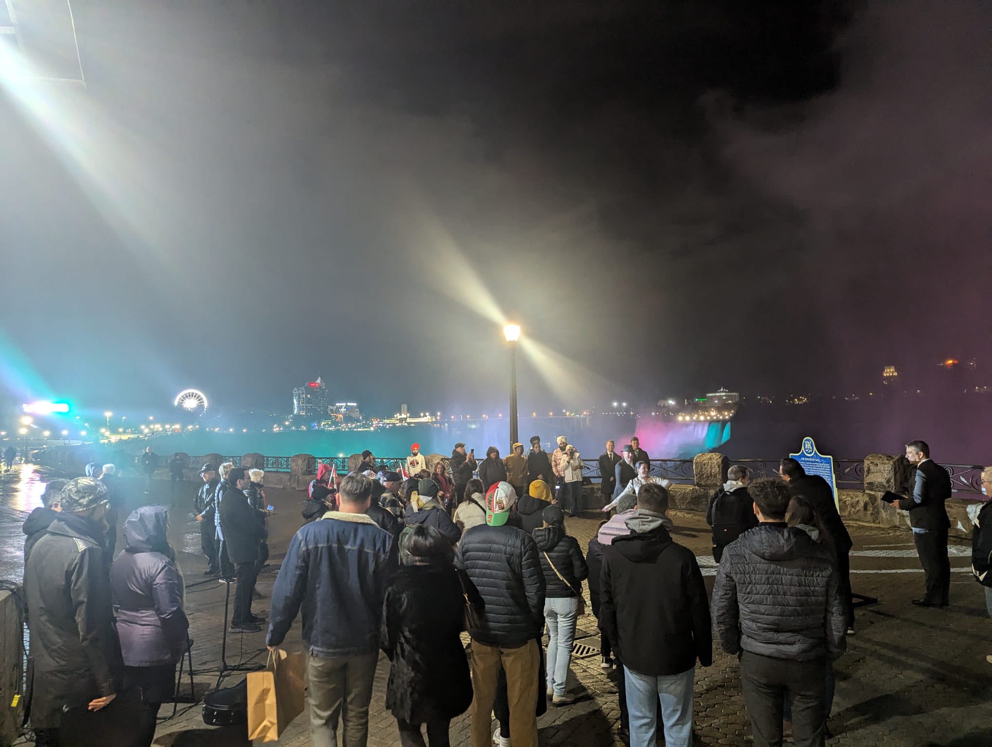 Members of the Hungarian diaspora, Canadian dignitaries, and cultural enthusiasts watch the Rozmaring Dance Ensemble perform at Niagara Falls during the 1956 Hungarian Revolution commemoration.