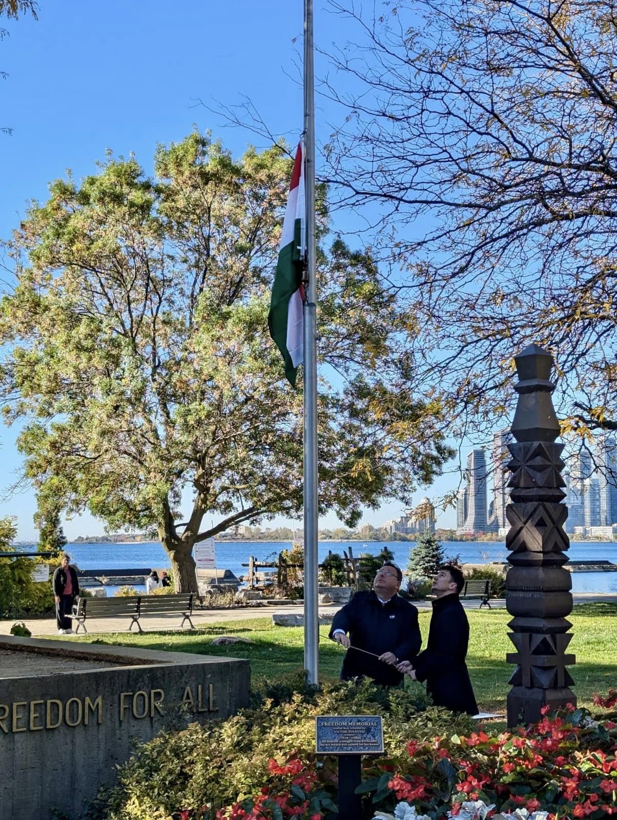 Sándor Balla and Dr. János Jákó raising the Hungarian national flag at Budapest Park, Toronto, honoring the heroes of the 1956 Hungarian Revolution.