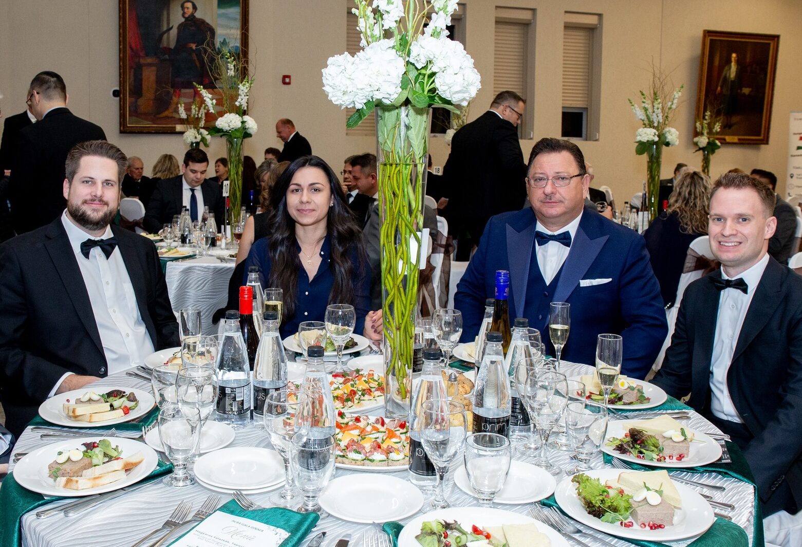 Balázs Csutora, Mária Libaiová, Sandor Balla, and Dr. Gábor Péter Artner seated together at the Hungarian Heritage Month gala dinner in Toronto.