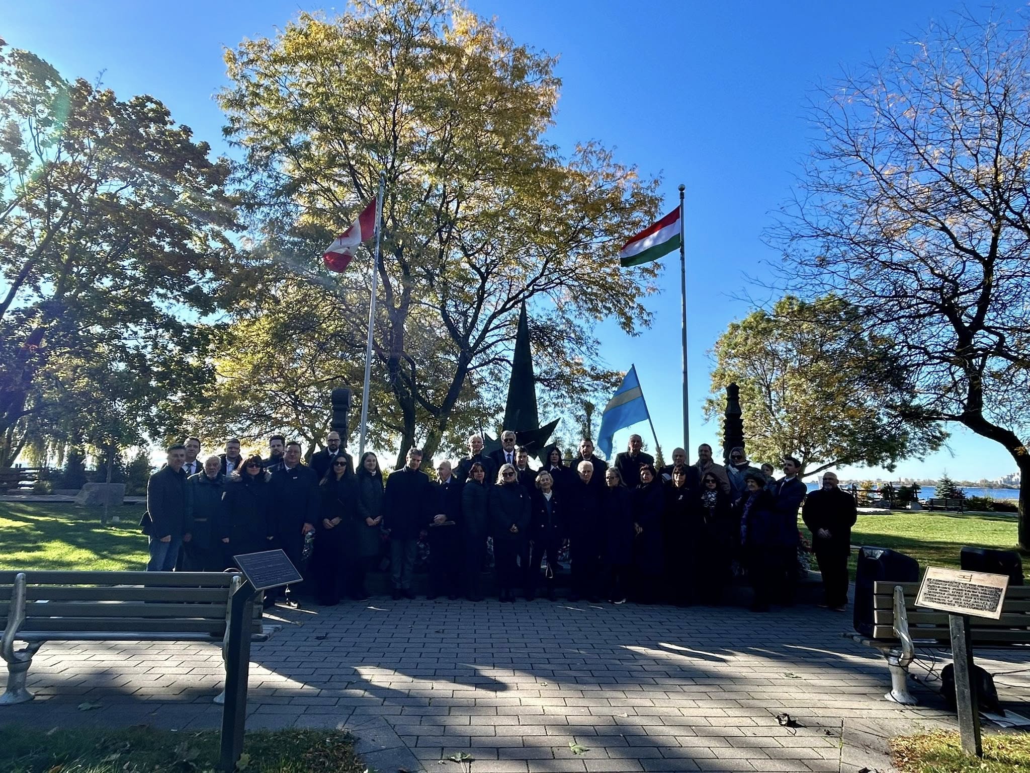 Guests and dignitaries gathered at Budapest Park, Toronto, for the Hungarian Flag Raising Ceremony honoring the 1956 Hungarian Revolution.