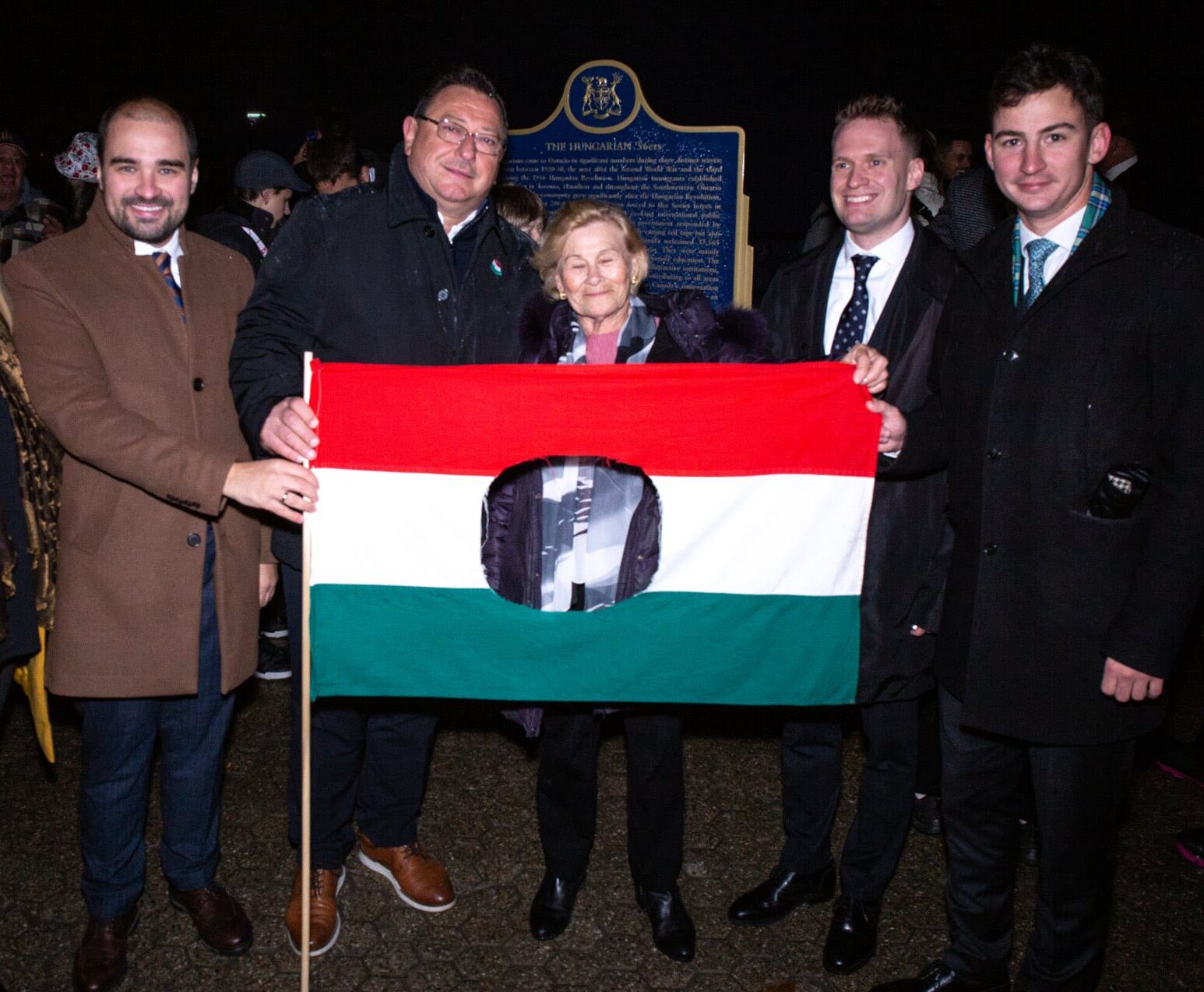 Igaz Mate Árpád, Deputy Head of Mission and Economic and Trade Attaché of the Hungarian Consulate; Sandor Balla, Executive Director of the HEPA Regional Office Canada; Dr. Gábor Péter Artner, Deputy CEO of HEPA; and Dr. János Jákó, Consul General of Hungary in Toronto, standing with a survivor of the 1956 Hungarian Revolution at the Niagara Falls commemoration.