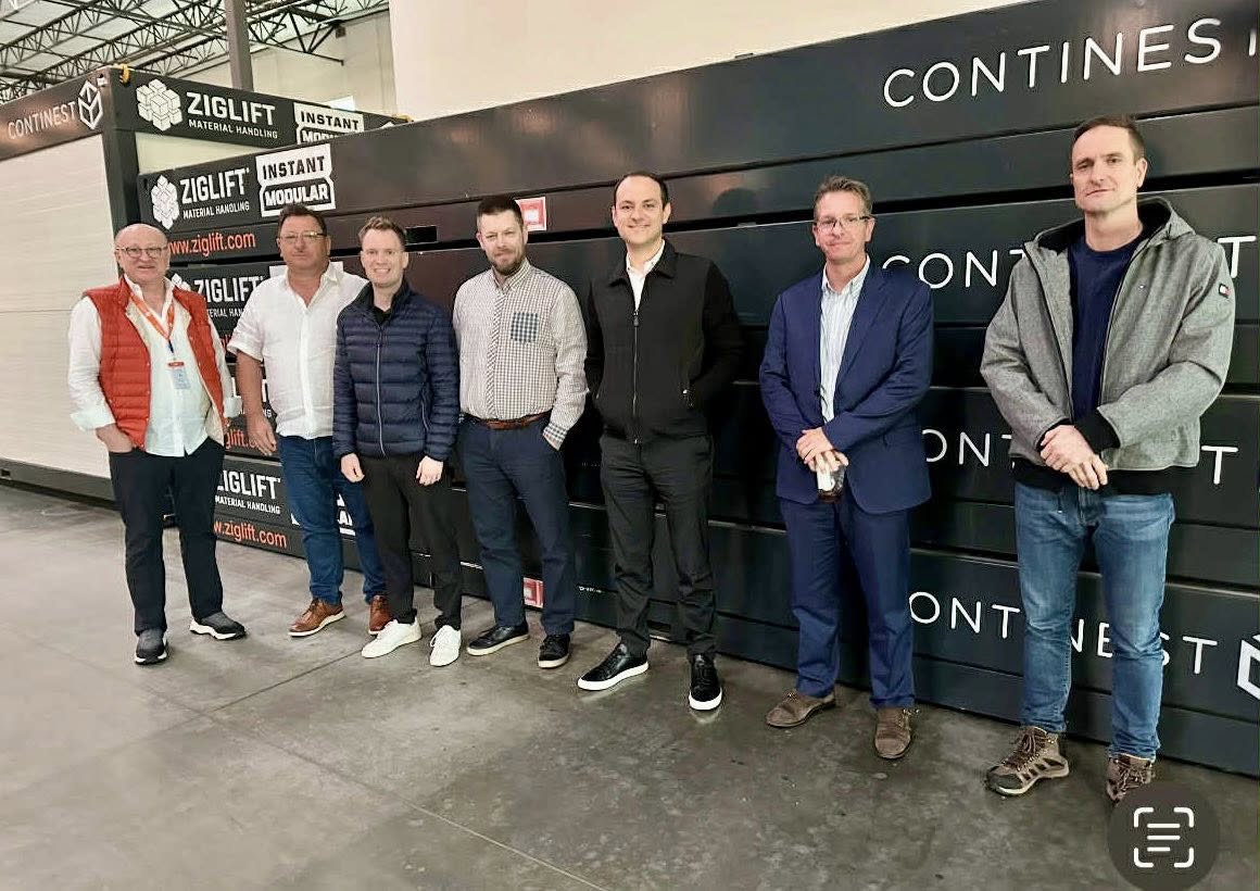 HEPA delegation, Hungarian company representatives, and Ziglift team in front of Continest modular container systems in Los Angeles