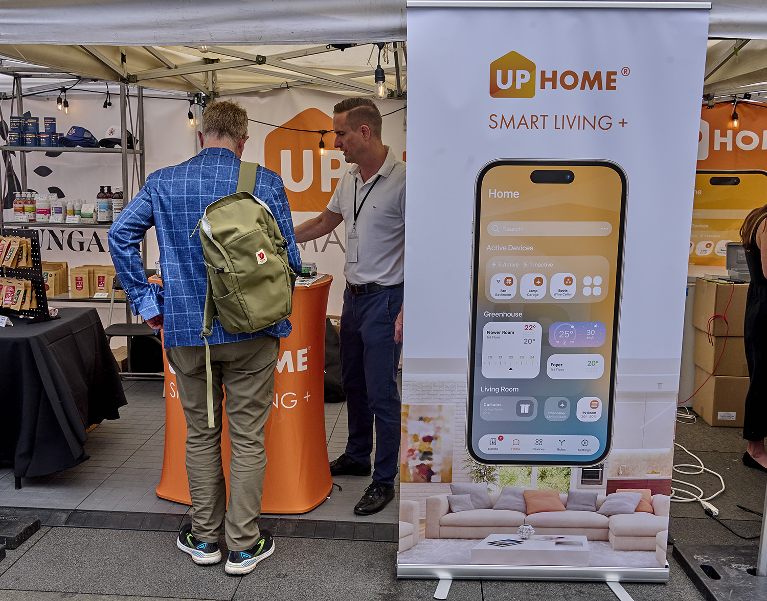 Visitors explore the Uphome Canada tent showcasing smart home technologies at HungaroFest Toronto 2026.